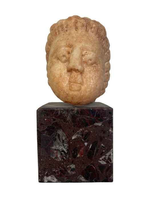 Tête d’enfant en marbre ancien à identifier